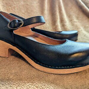 Dansko Black Leather Mules with Tan Sole